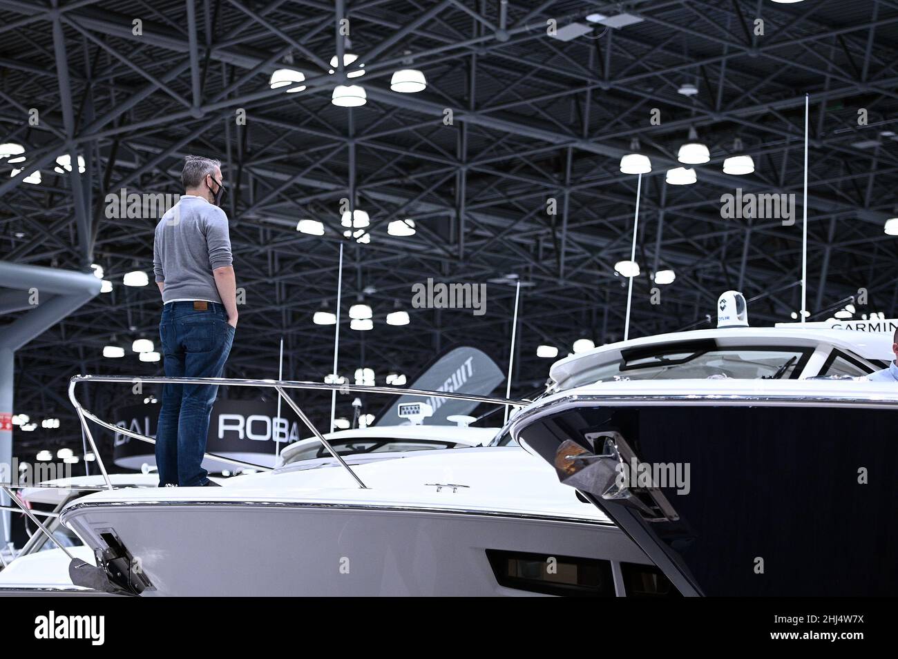 A visitor stands on the bow a Pursuit Boat luxury yacht during 2022 New
