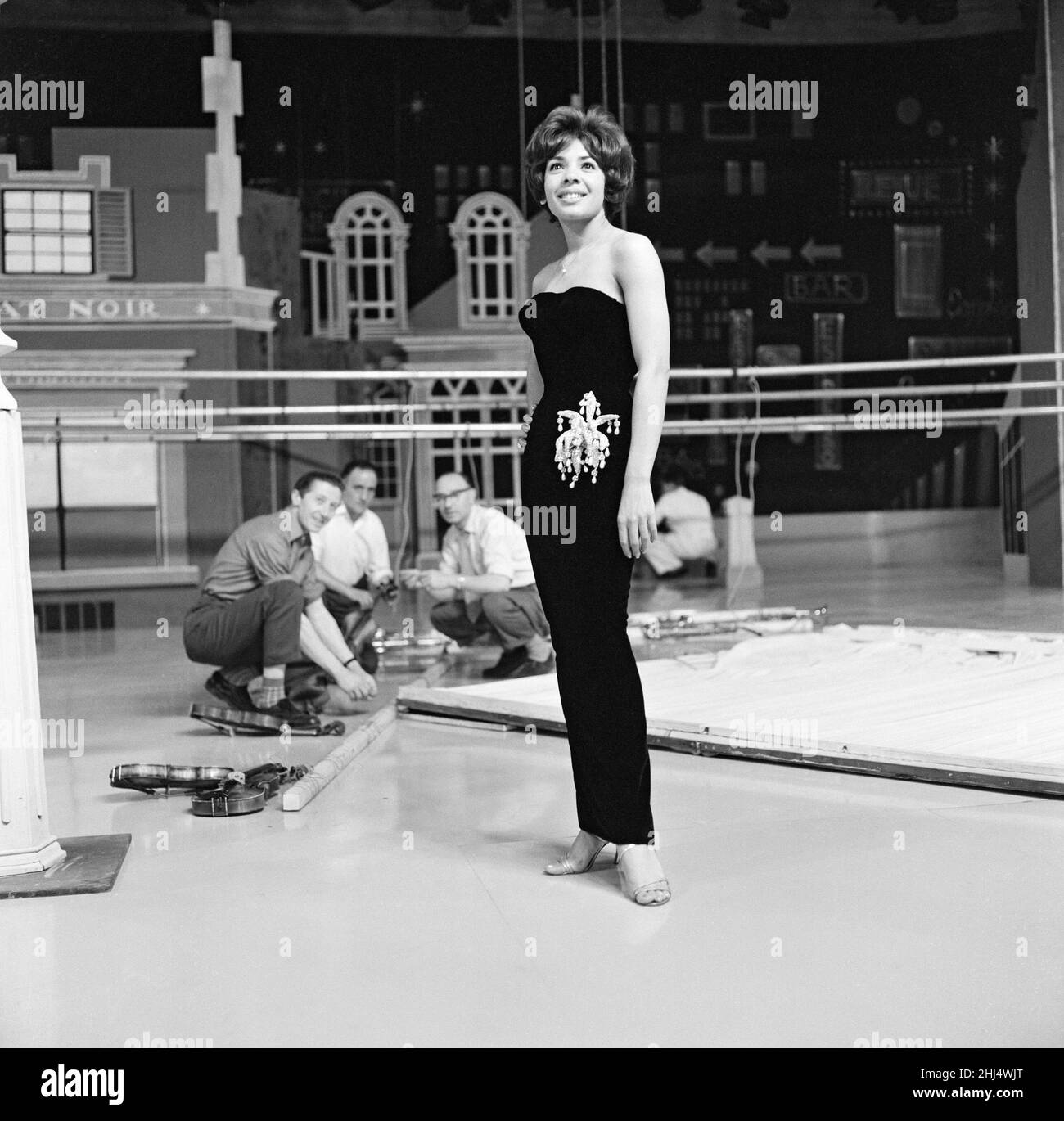 Shirley Bassey wearing the hip-hugging black velvet dress that she says catches mens' eye. She was photographed at Wood Green Television Studios where she was rehearsing. 17th June 1960. Stock Photo