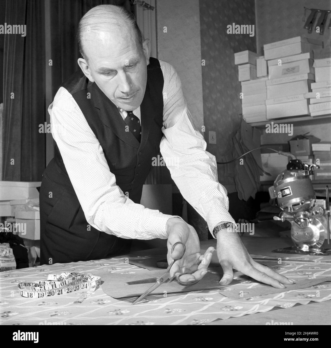 Tailor measuring Black and White Stock Photos & Images - Alamy