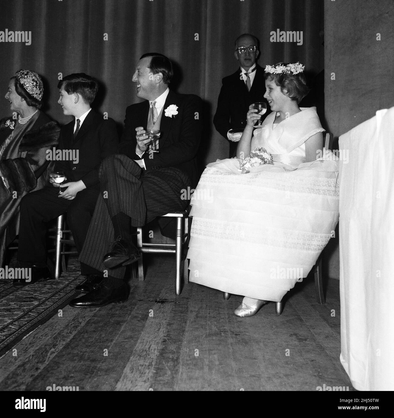 The wedding of Pamela Mountbatten and David Hicks at Romsey Abbey, Hampshire. Prince Charles and Princess Anne toast the couple with non-alcoholic cider alongside the best man John Knatchbull, 7th Baron Brabourne. 13th January 1960. Stock Photo