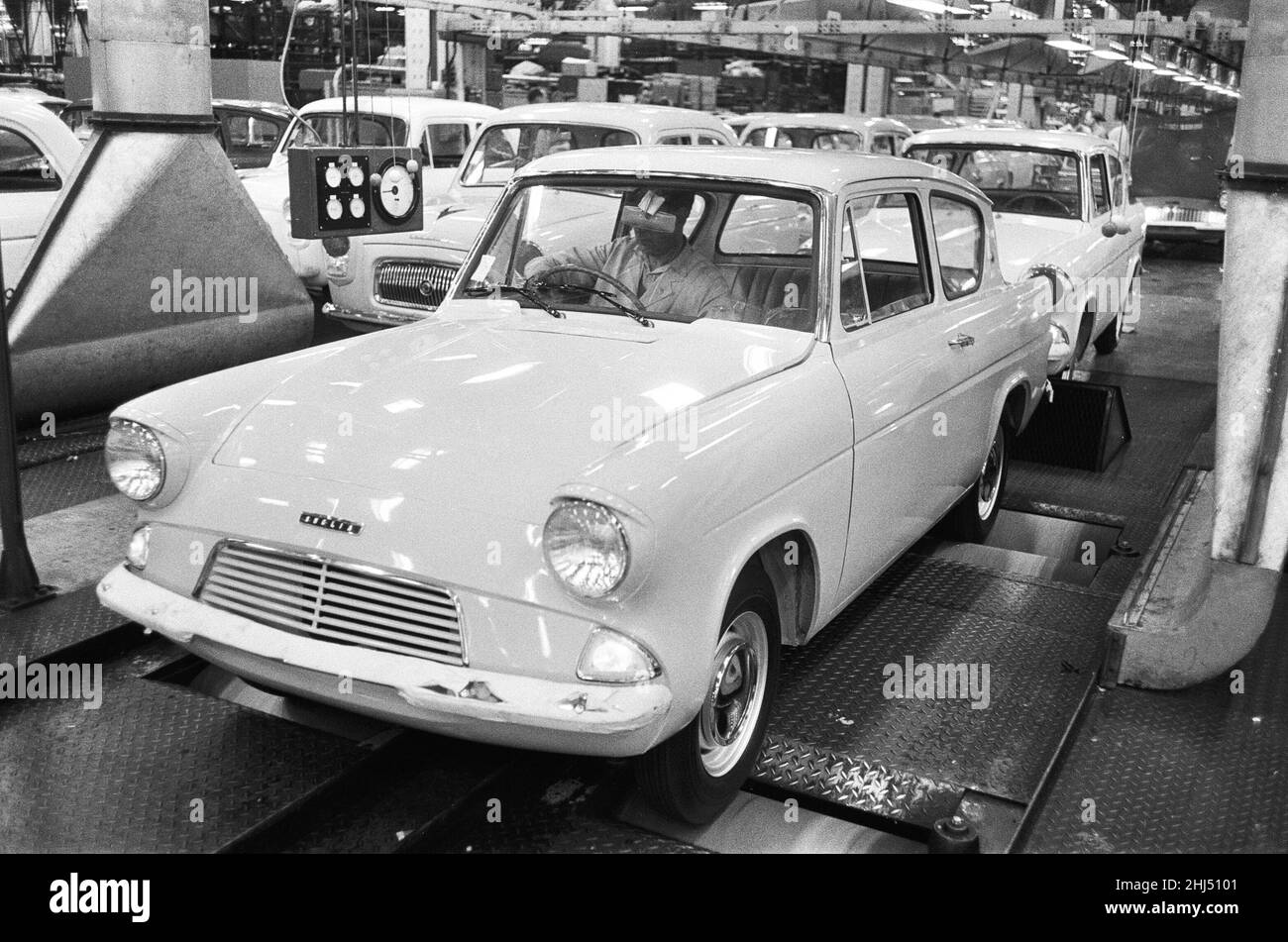 New Ford Anglia cars coming off the production line at the new Ford paint, trim and assembly plant in Dagenham, Essex.27th October 1959. Stock Photo