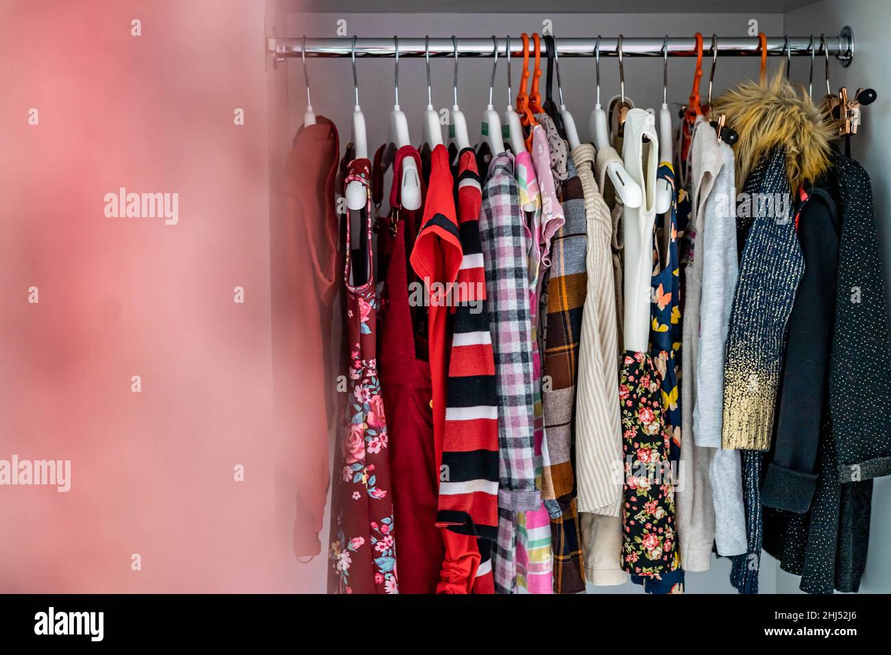 Female childish wardrobe apparel hanged comfortable vertical storage Marie Kondo minimalist