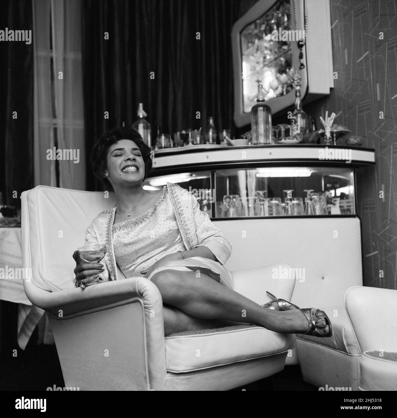 Shirley Bassey in her new house in central London, where she held a house warming party on Sunday night. 10th January 1960. Stock Photo