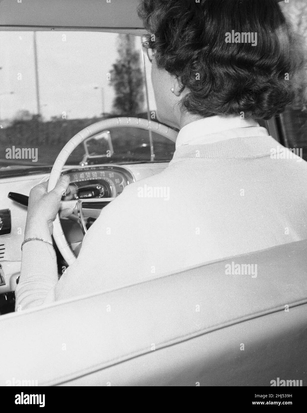 Woman learner driver seen here behind the wheel of a Vauxhall Victor. 1st December 1959 *** Local Caption *** Watscan -  - 09/03/2009 Stock Photo