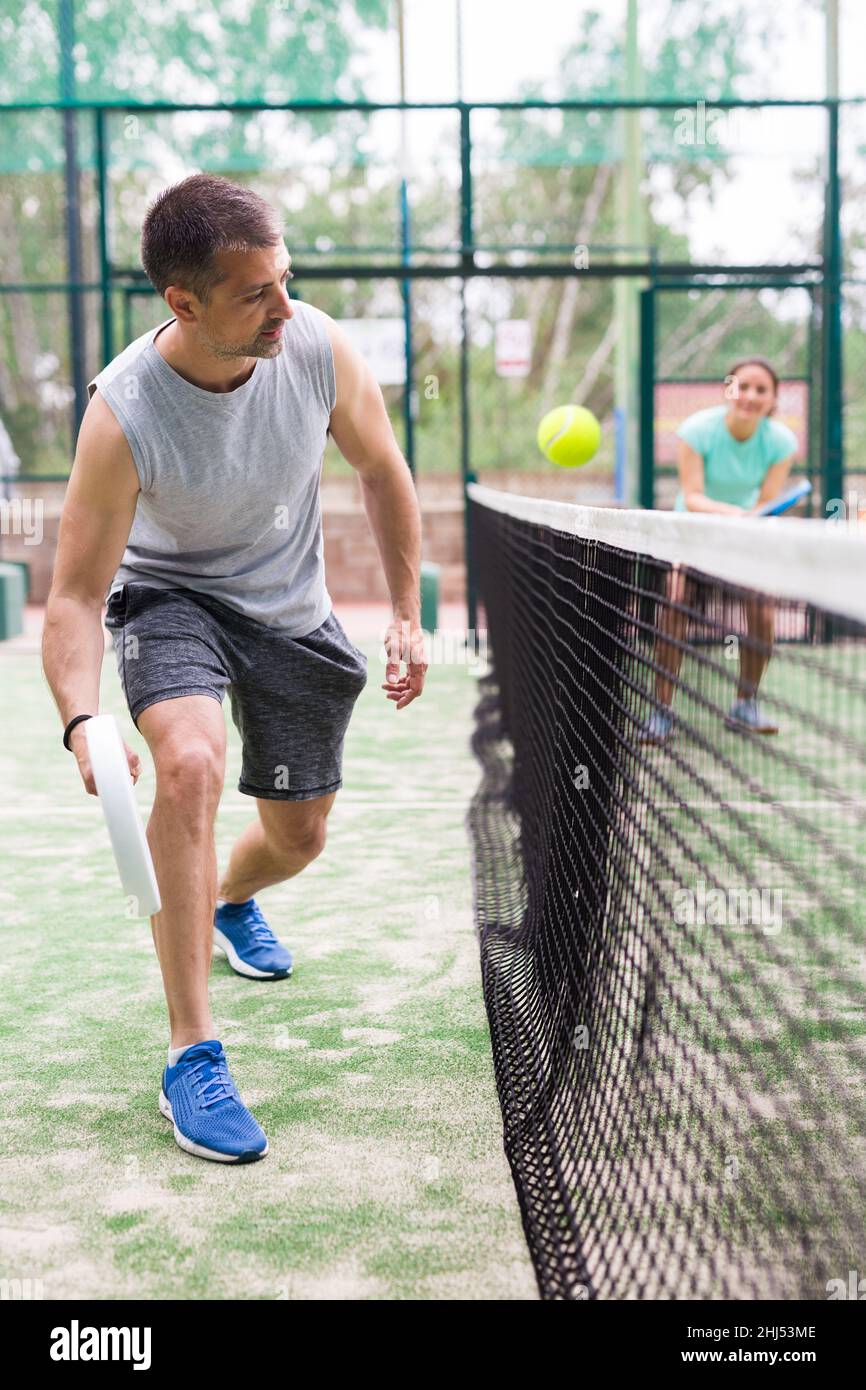 Doubles play in an outdoor paddle game court Stock Photo Alamy