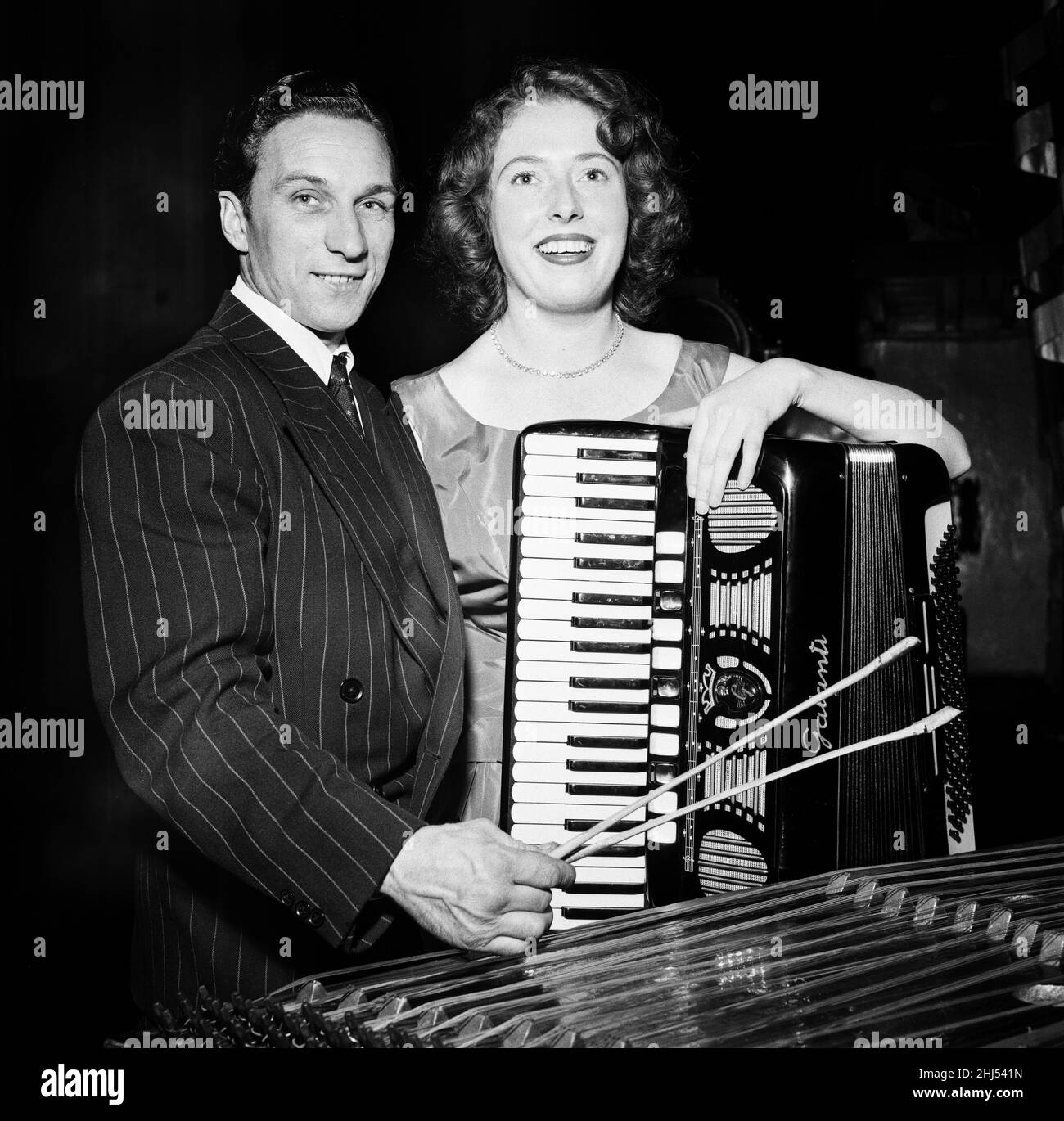 Opportunity Knocks, Winners, 11th October 1956. Arthur Cooper, Lorry driver from Essex, who plays the Dulcimer, and Phyllis Gillingham, Secretary from Twickenham who plays the Accordion. They have won a trip to the United States to play and be seen on Lou Goldberg's regional amateur hour, syndicated to over 100 stations in America. Stock Photo