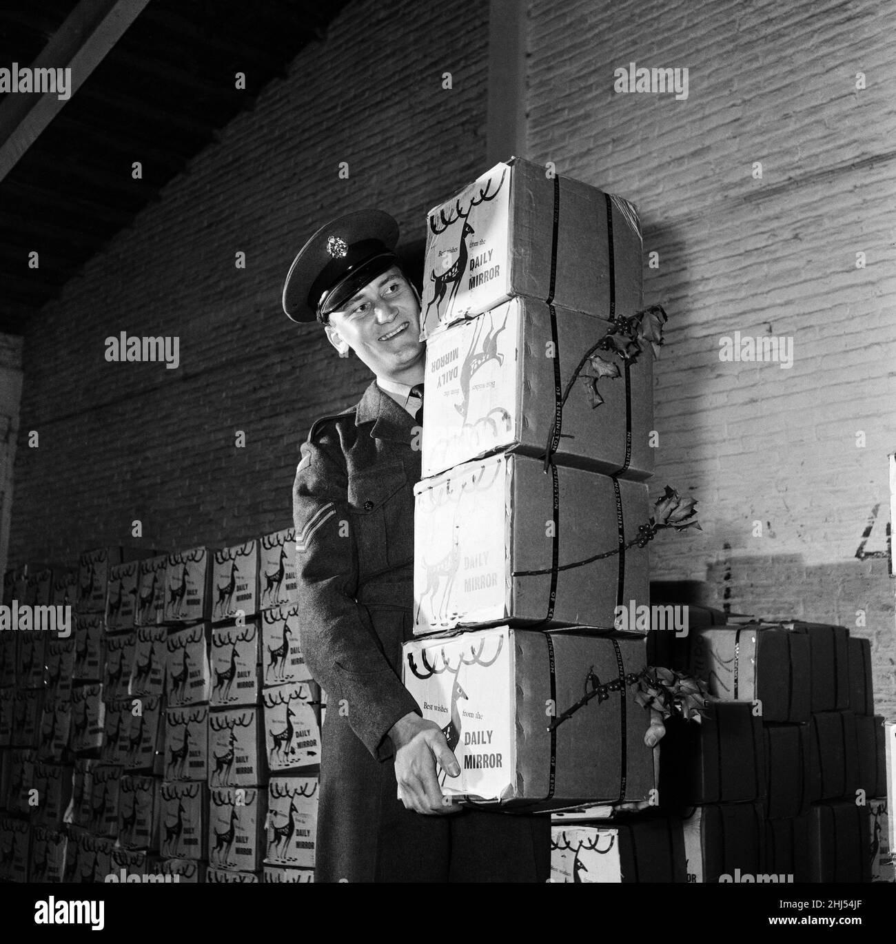 Corporal Peter Symmonds at a Nicosia airfield with hampers packed with good things, they are gift from the Daily Mirror - on behalf of its millions of readers - to the British Servicemen on duty in remote outposts in strife-torn Cyprus. December 1958. Stock Photo