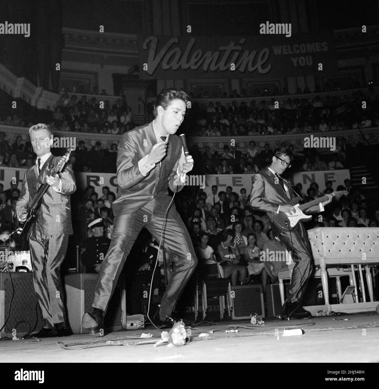 Pop concert at the Royal Albert Hall presented by Roxy, Marilyn and Valentine magazines to thousands of youngsters, attended by acts such as Adam Faith and Cliff Richard with his group The Shadows . Pictured performing are Cliff Richard and the Shadows with Hank Marvin on guitar (right). 18th September 1960. Stock Photo