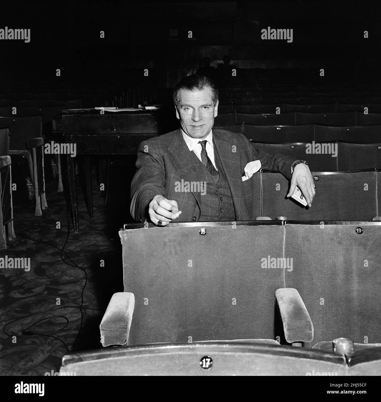 Laurence Olivier pictured at the Opera House, Manchester, where Vivien Leigh is appearing in the play 'South Sea Bubble', by Noel Coward. 19th March 1956. Stock Photo