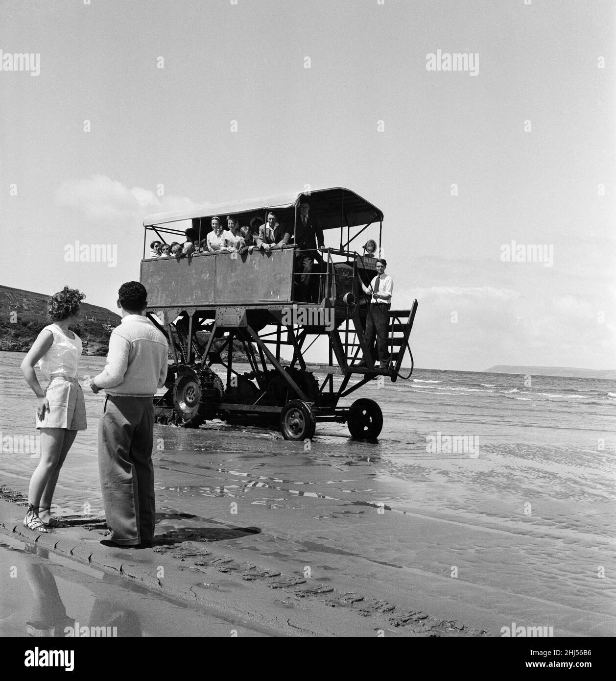 With 30 passengers aboard, the sea tractor at work between Burgh Island and mainland at Bigbury on Sea, Devon. 13th June 1956. Stock Photo