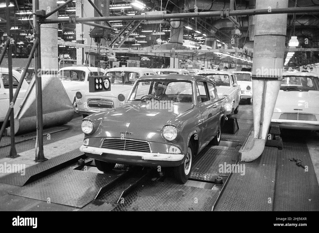 New Ford Anglia cars coming off the production line at the new Ford paint, trim and assembly plant in Dagenham, Essex.27th October 1959. Stock Photo