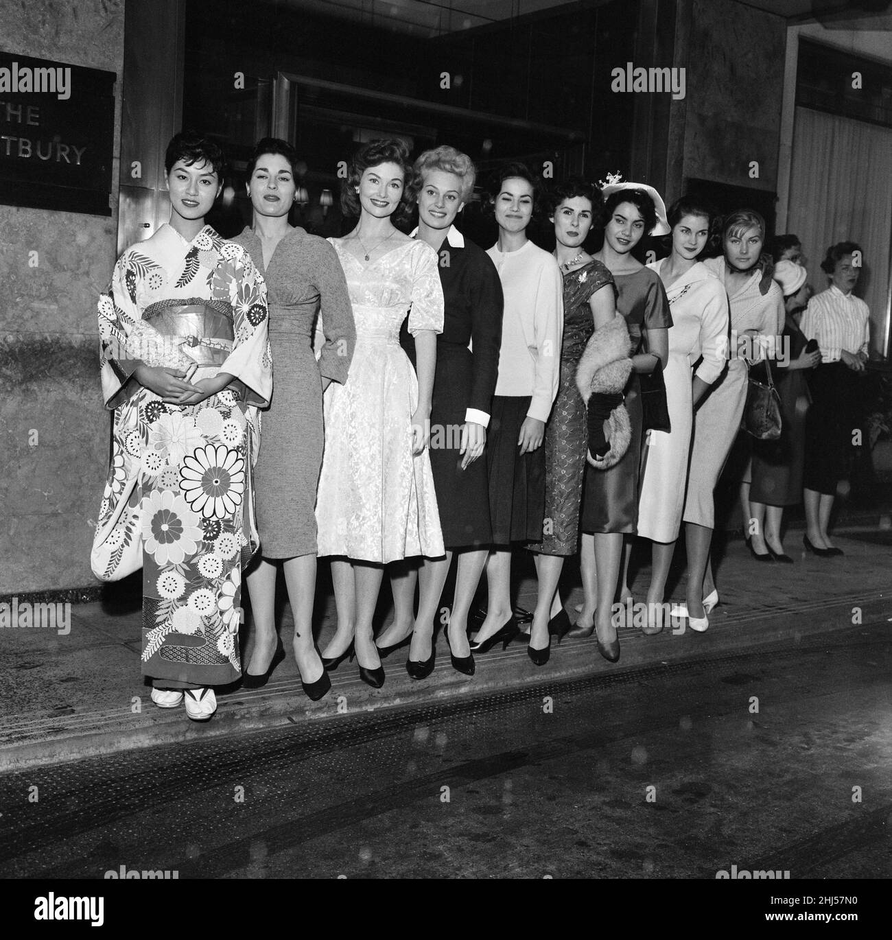 1958 Miss World Beauty Contestants, pictured standing together outside their hotel, The Westbury, London, 5th October 1958. From left to right, Miss Japan Hisako Okuse, Miss United Kingdom Eileen Elizabeth Sheridan, Miss USA Nancy Anne Corcoran, Miss Holland Lucienne Struve, Miss France Claudine Oger, Miss Canada Marilyn Anne Keddie, Miss Brazil Sonia Maria Campos, Miss South Africa Penelope Anne Coelen and Miss Italy Elisabetta Velinsky. Stock Photo