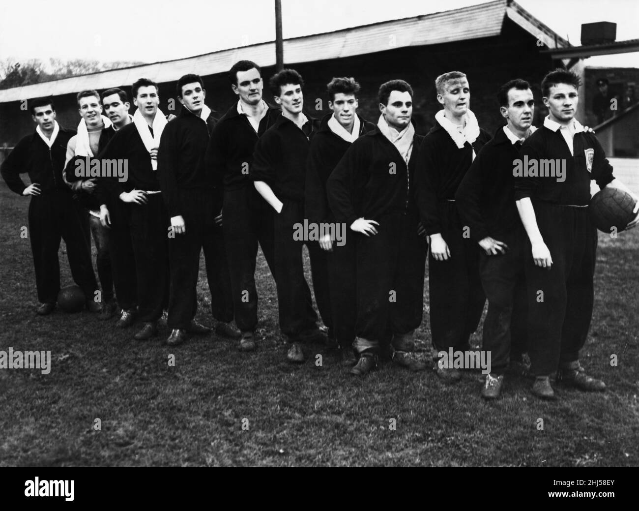 The Scottish national team take a break from training at Dunbar to line up for a photo.(From left to right) Thomson, Slater, McKay, Baird, John Baxter (Hibs), Baillie. Jim Baxter (Raith rovers), Ewen, Currie, Young, Sneddon and Wilson. 9th December 1958 Stock Photo