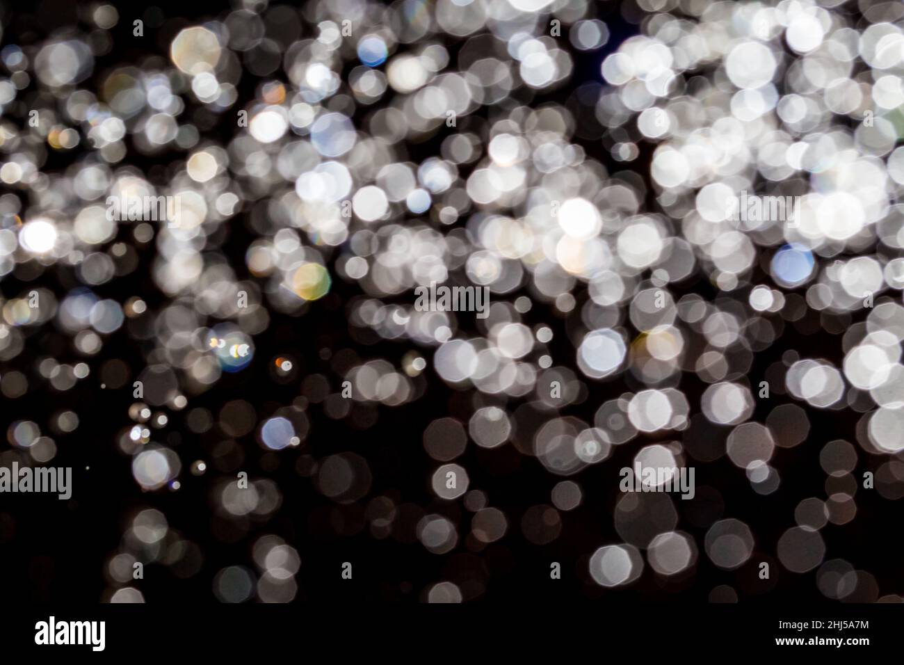 Abstract bokeh texture on black background Stock Photo - Alamy