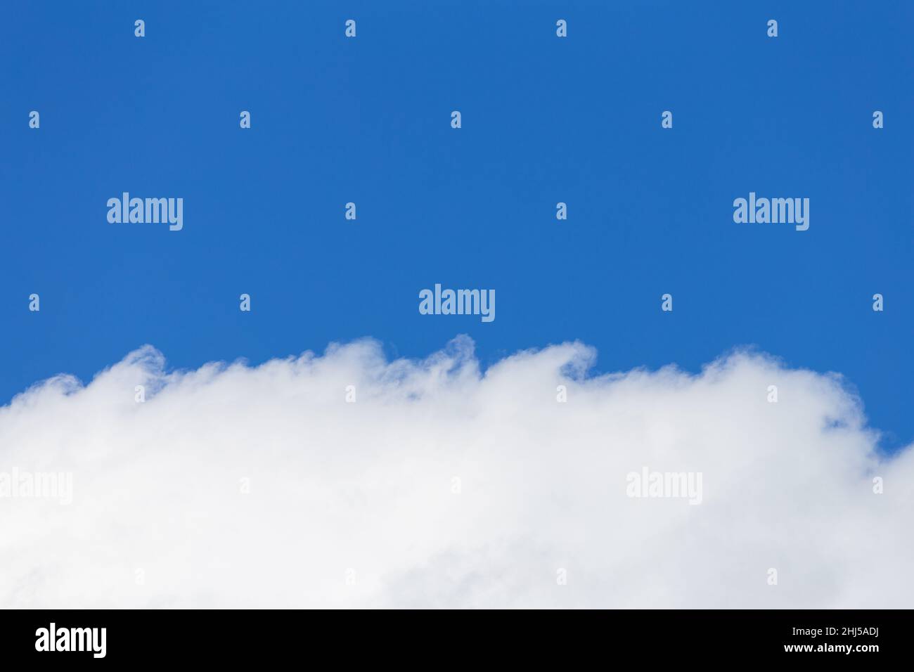 Fluffy white cloud with background of clear blue sky Stock Photo - Alamy