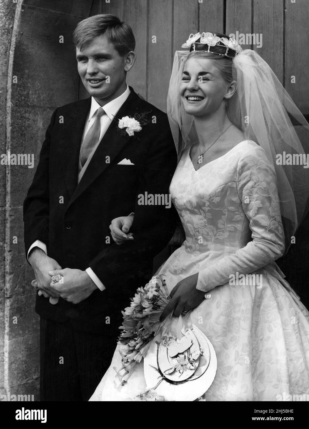 Former Welsh international and Llanelli rugby star Terry Davies, of Bynea, and his smiling bride, Miss Gillian James, after their wedding at St. David's Church, Carmarthen. 29th September 1961. Stock Photo