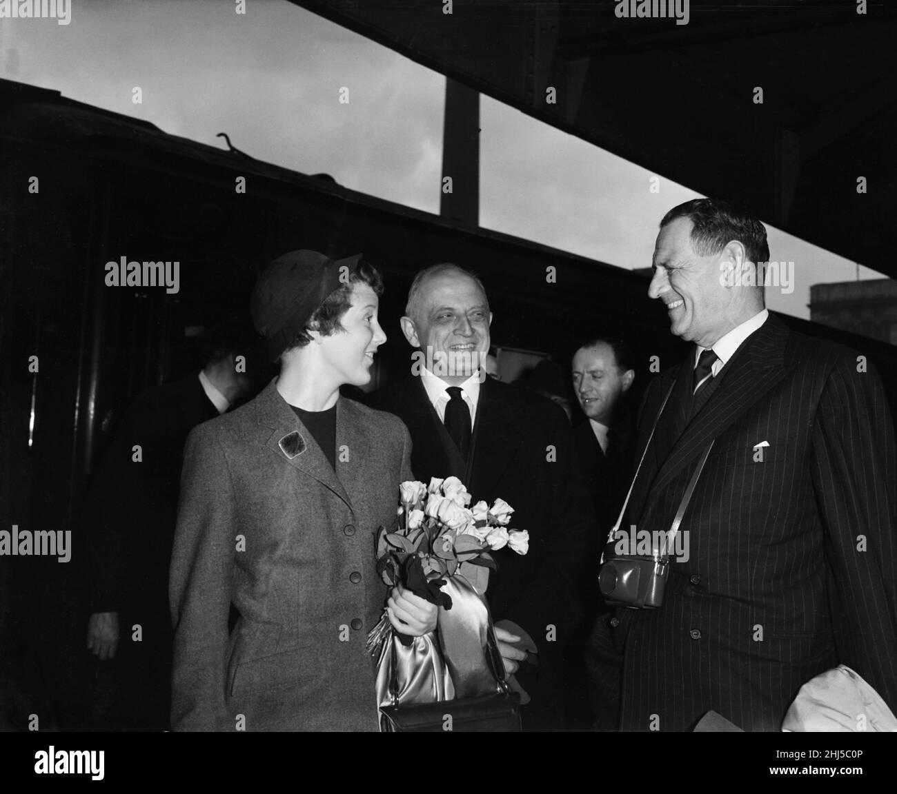 King Frederik of Denmark (right) with his daughter Princess Margrethe at Victoria Station, with the Danish Ambassador (centre) Mr Steensen-Leth. Princess Margrethe is returning to England to continue her schooling at North Foreland Lodge, Near Basingstoke. 3rd May 1956. Stock Photo
