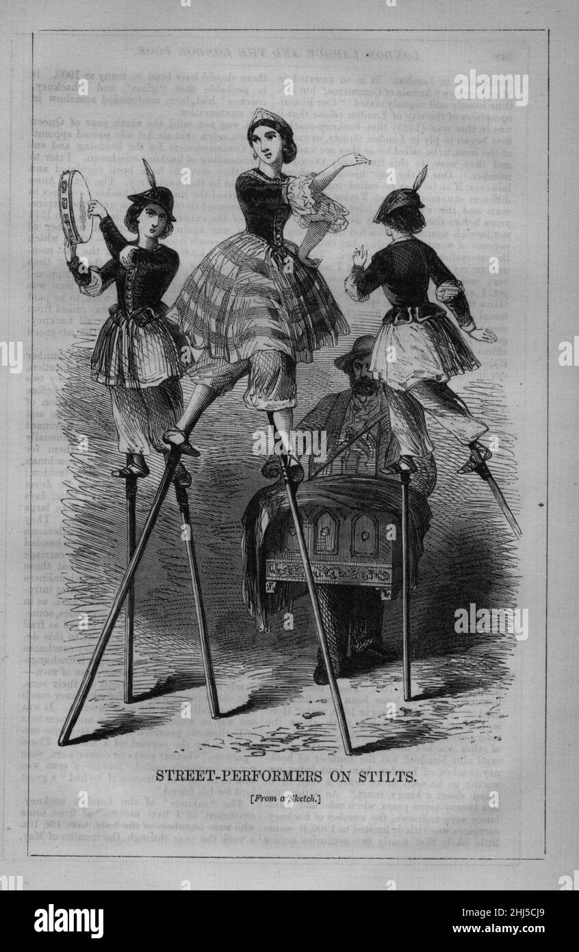 Street-Performers on Stilts. Stock Photo