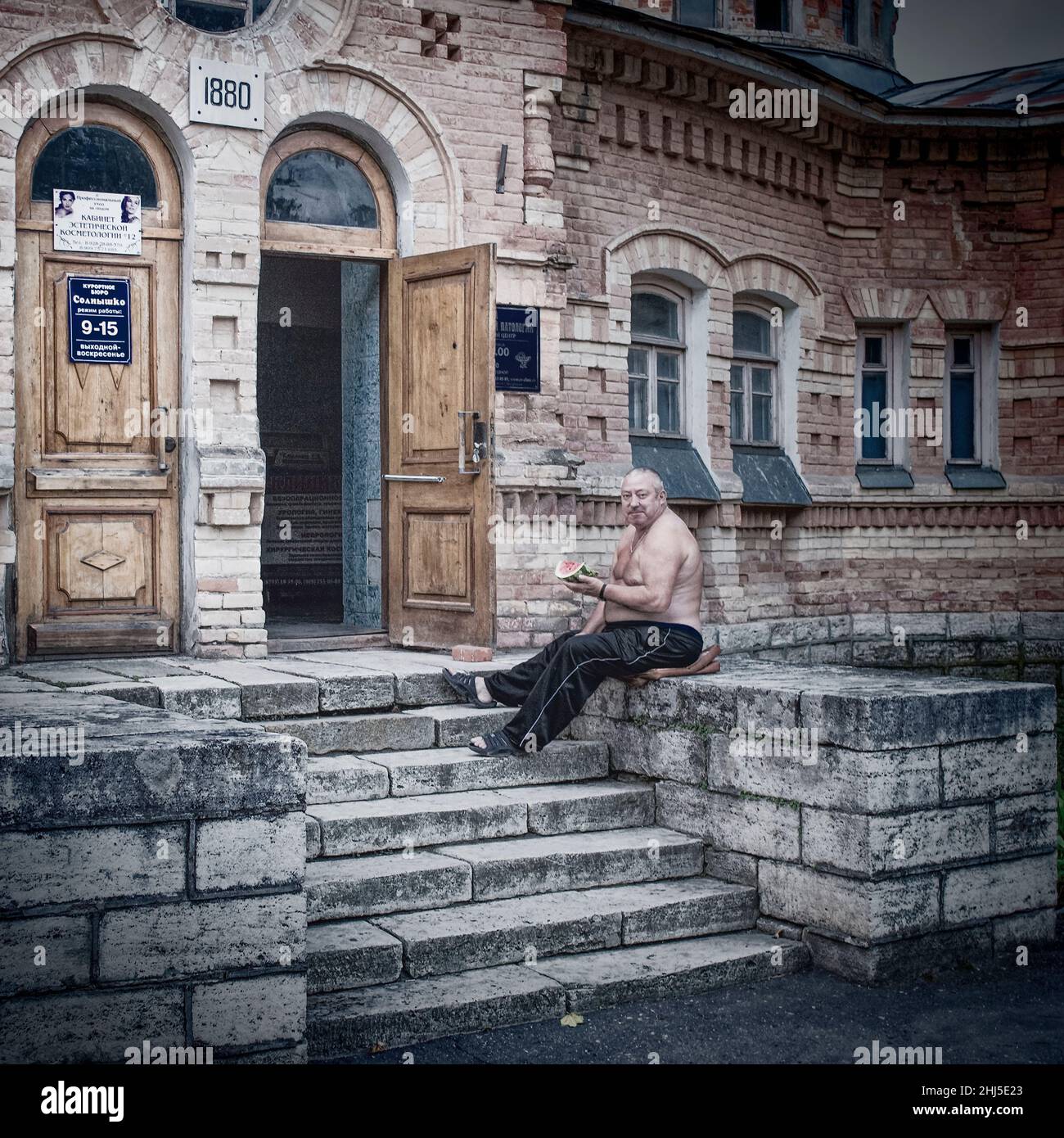 28th of August 2016, Russia, Pyatigorsk, man sits on the porch of sanatorium coloured Stock Photo