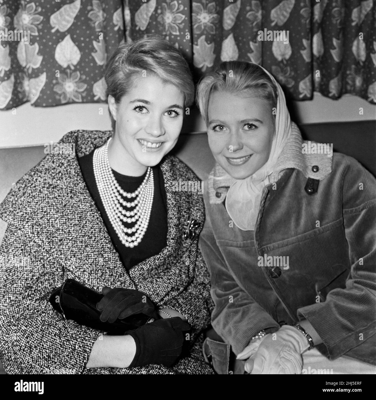 Julia Lockwood (left) and Juliet Mills who lay Peter Pan and Wendy at the Scala Theatre this Christmas. Julia was at London Airport tonight to meet Juliet when she flew in from New York. They last met five years ago. 30th October 1960. Stock Photo