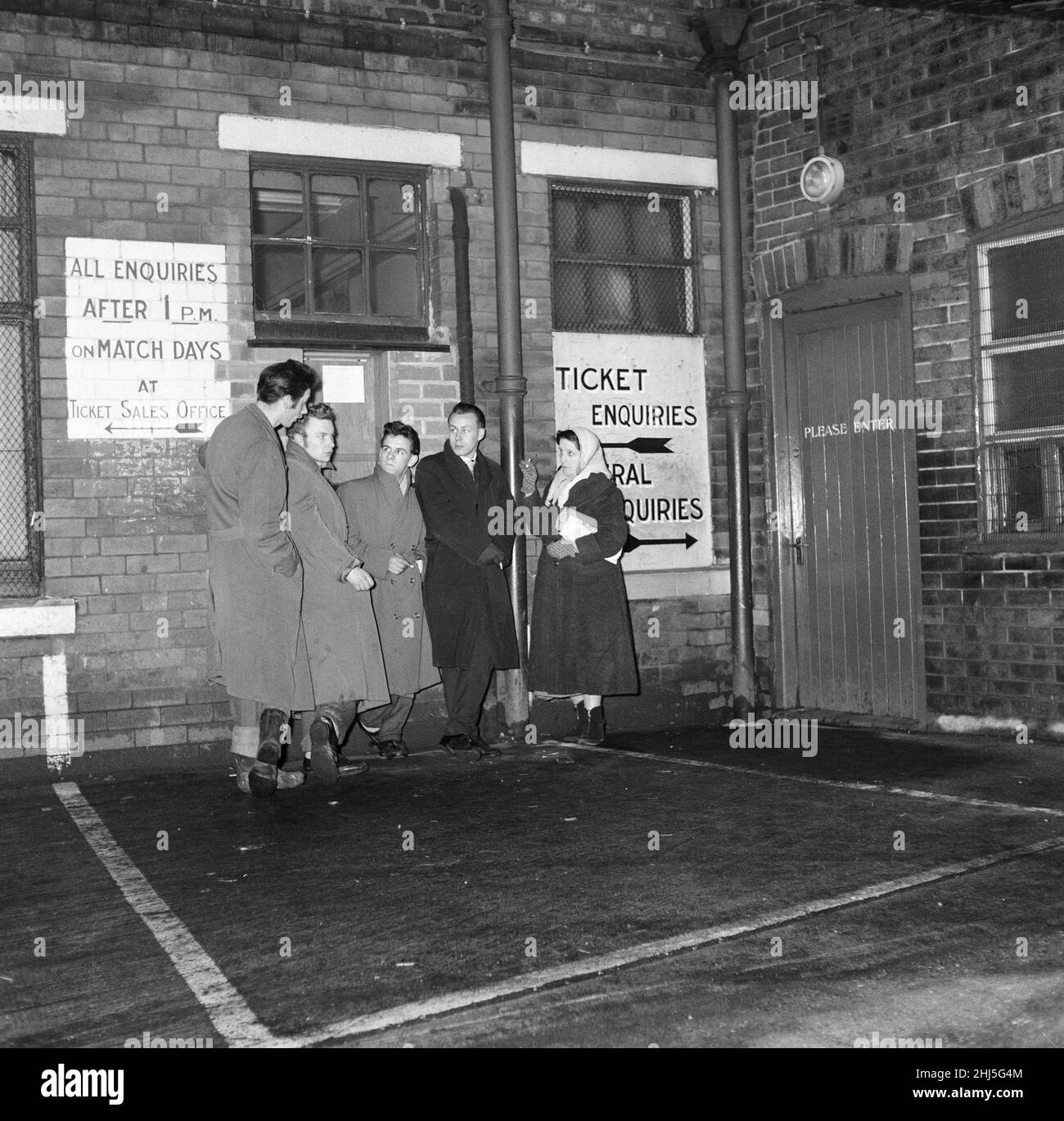 Fans queue at Old Trafford for tickets to see Manchester United verses Sheffield Wednesday, in the postponed 5th round fifth round F.A Cup tie this coming Wednesday. They will be seeing a re-born Manchester United, who have suffered a tragic blow with the Munich Air Disaster only days before on 6th February 1958.  Among the first fans queuing for tickets is Mrs Gladys Paris (pictured on the right)  This picture taken 15th February 1958 Stock Photo