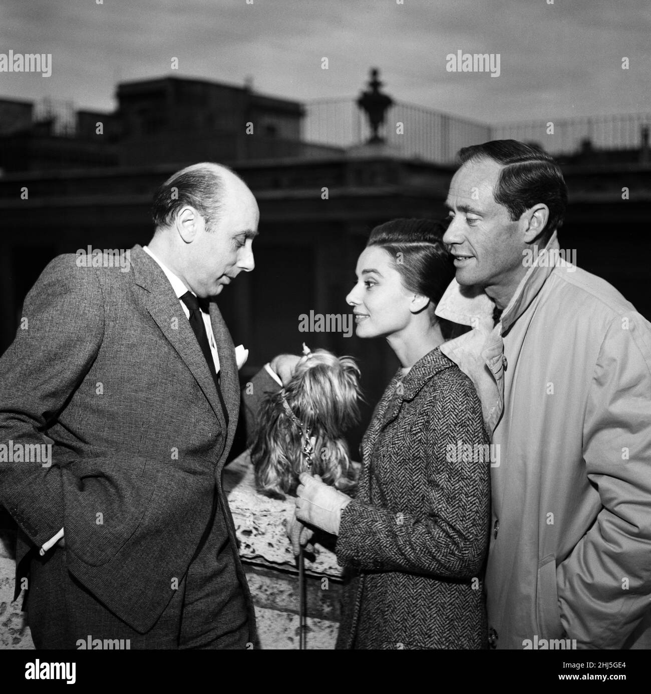 Actress Audrey Hepburn and her husband Mel Ferrer (right) photographed in Rome. Also with them is Daily Mirror journalist Donald  Zec (left). 8th January 1960. Stock Photo