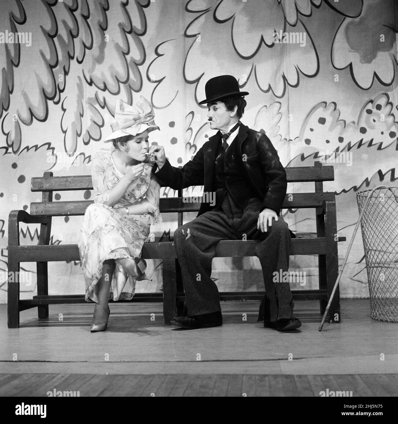 Actress Juliet Mills with her father, actor John Mills who is dressed as Charlie Chaplin. 20th July 1960. Stock Photo