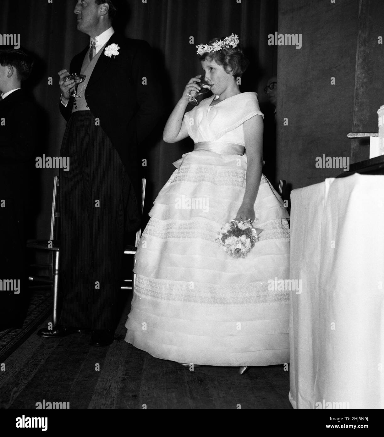 The wedding of Pamela Mountbatten and David Hicks at Romsey Abbey, Hampshire. Princess Anne toasts the couple with non-alcoholic cider. 13th January 1960. Stock Photo