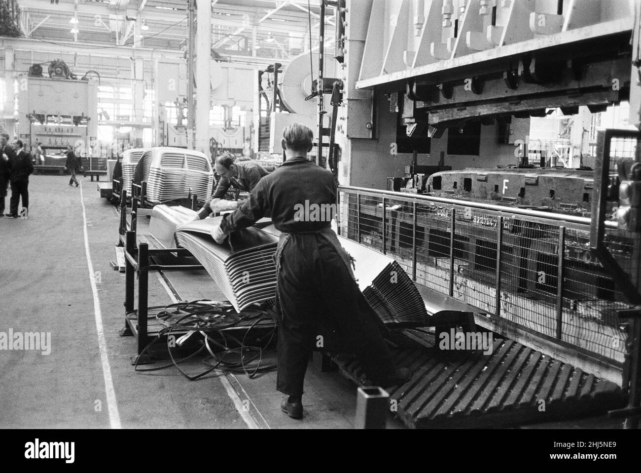 New Ford Anglia cars coming off the production line at the new Ford paint, trim and assembly plant in Dagenham, Essex. 27th October 1959. Stock Photo