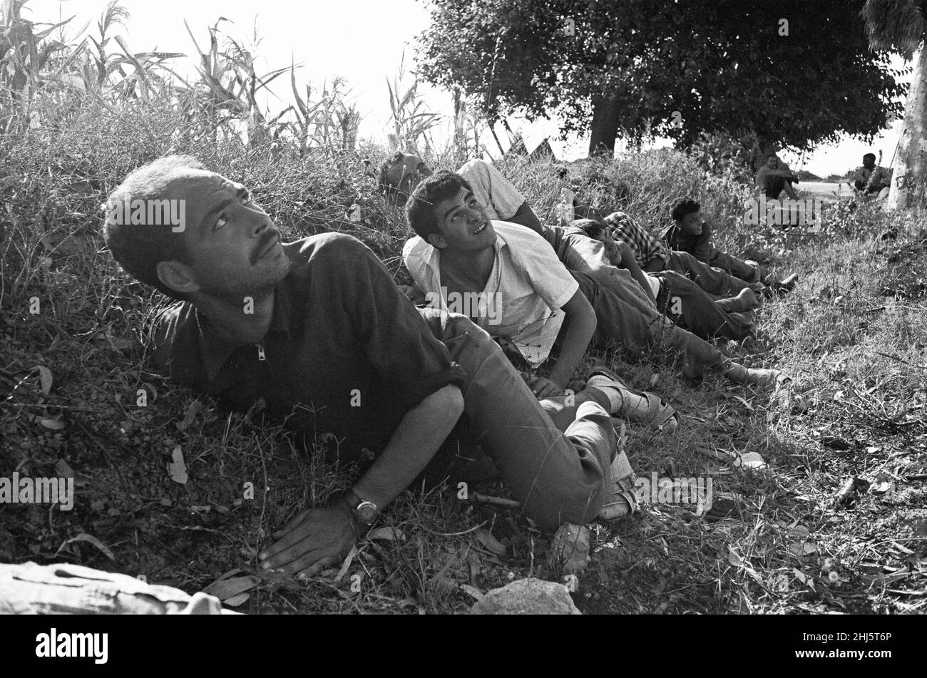 Refugees from the Tunisian port city of Bizerte seek cover in a roadside  ditch as French Air Force jets strafe the roads 20th July 1961The crisis  arose after Tunisian forces surrounded and