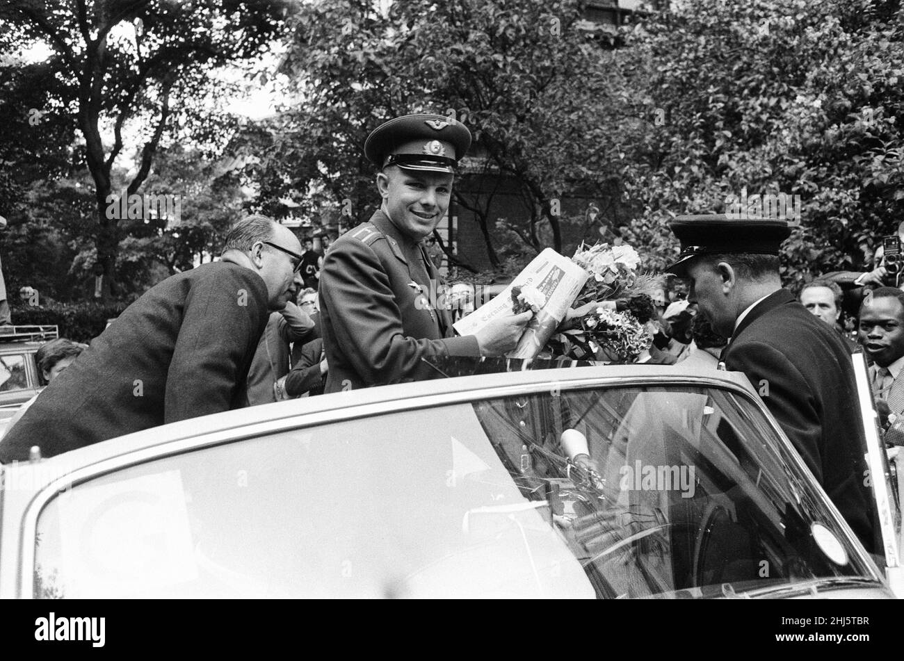 Yuri Gagarin,  Soviet Cosmonaut, the first human to journey into outer space when his Vostok spacecraft completed an orbit of the Earth (12th April 1961), visits Britain, Tuesday 11th July 1961. Our picture shows ... Yuri Gagarin is greeted by large welcoming crowds of people in the grounds of the Russian Embassy in Kensington Palace Gardens. Stock Photo