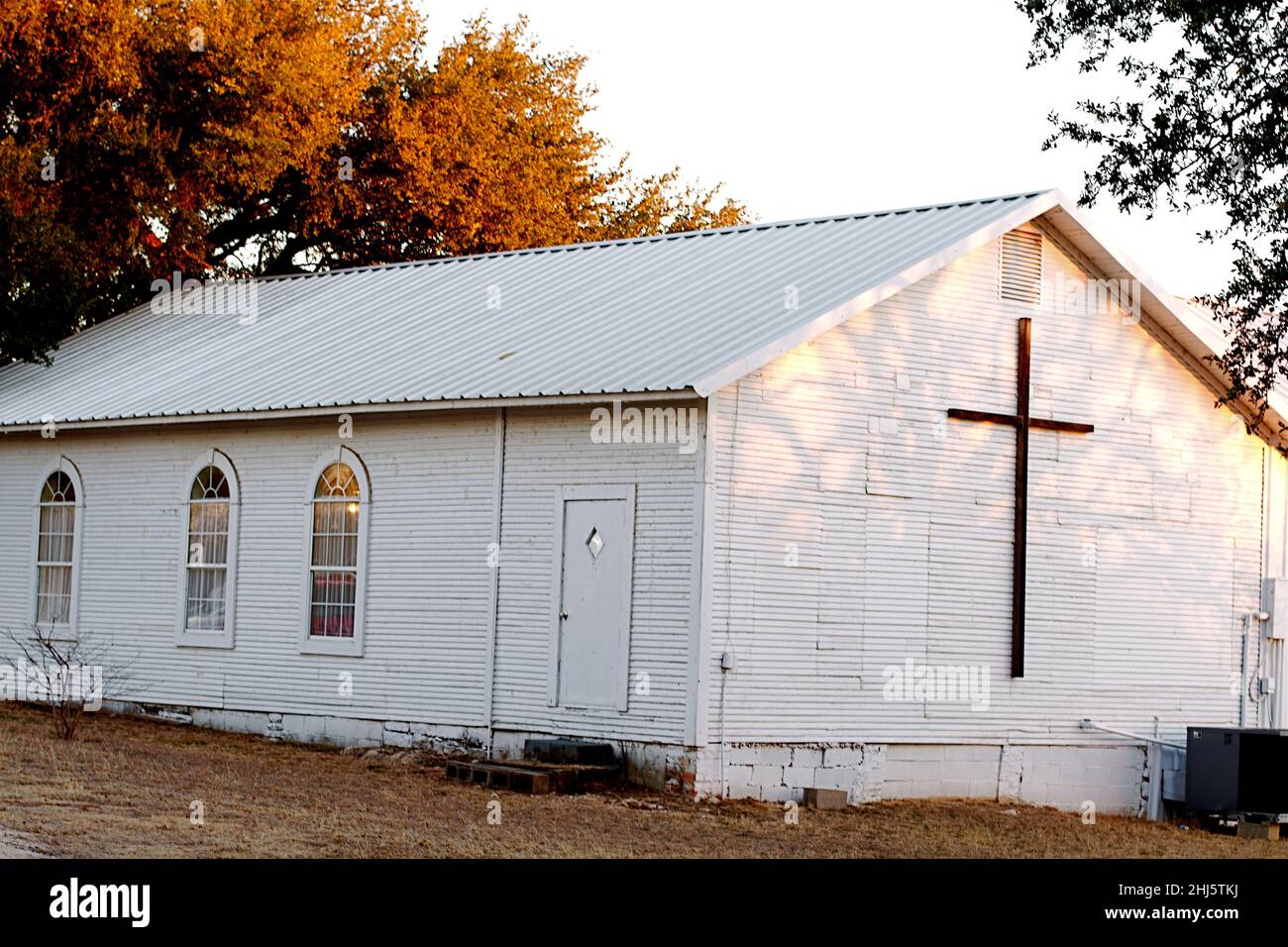 Old white church in the forest in fall Stock Photo - Alamy