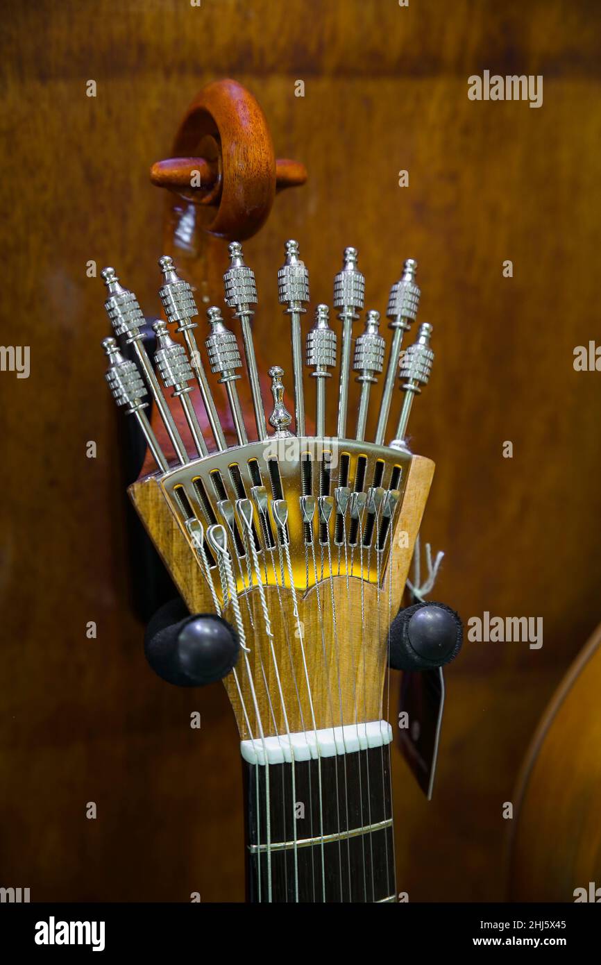 Traditional 12 string acoustic Portuguese guitar or guitarra for sale on display in a musical instrument shop in Porto, Portugal Stock Photo