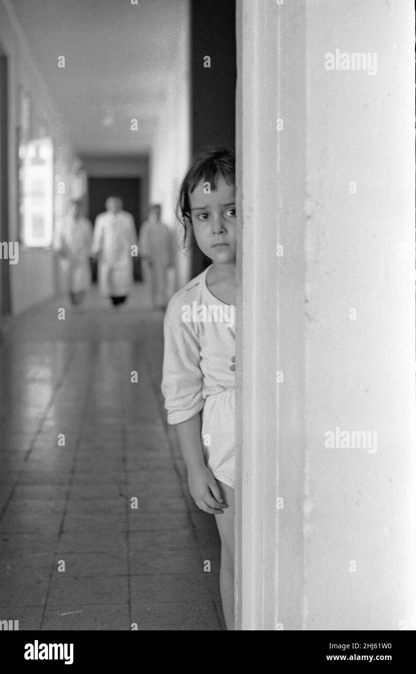 The Bizerte Crisis July 1961Where¿ my mummy? The anguished look of a little girl who has been parted from her mother. Four year old Latifa was taken to hospital after a French rocket blasted into her home in Bizerta. Her injuries were not serious. But now she wonders where her mother is? 21st July 1961 The crisis arose after Tunisian forces surrounded and blockaded the French naval base  at Bizerte in hopes of forcing France to abandon its last holdings in the country. After Tunisia warned France against any violations of Tunisian airspace, the French sent a helicopter up Tunisian troops respo Stock Photo