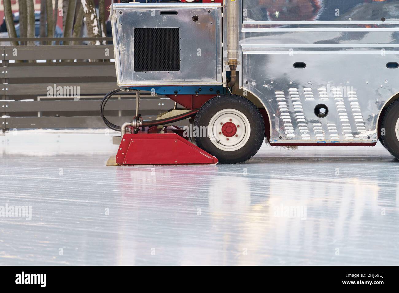 Polished ice maintenance machine ice preparation at rink between