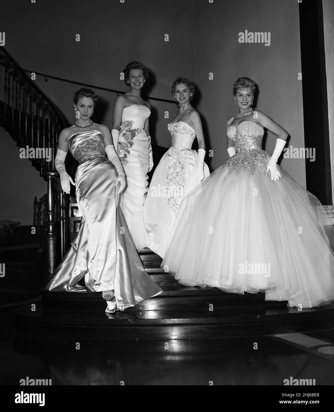 British Actresses preview the evening dresses they will be wearing this year at the Cannes Film Festival, pictured April 1956. Our picture shows ... Belinda Lee (far right) Stock Photo