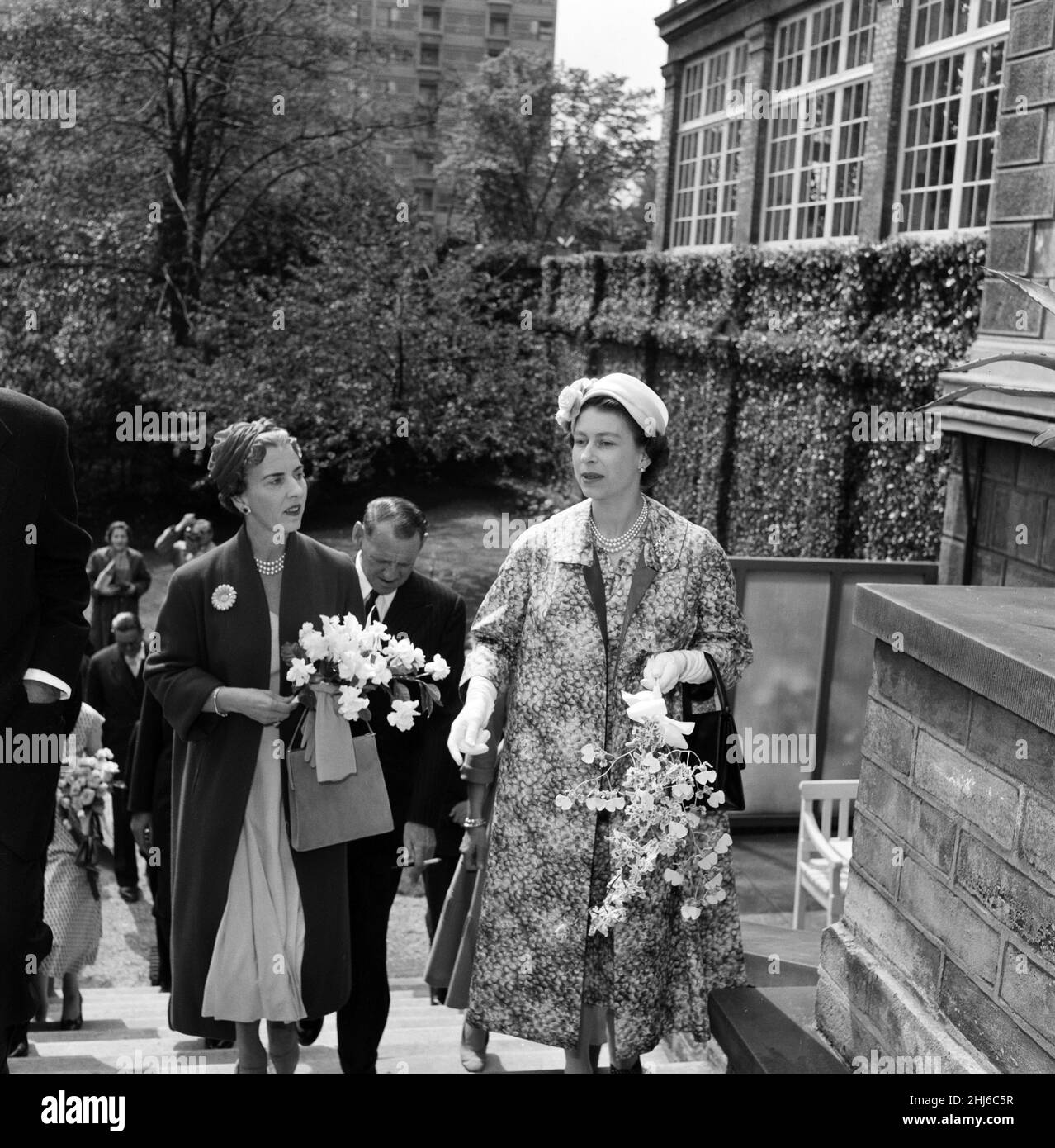 Queen Elizabeth II and Prince Philip, Duke of Edinburgh visit to Denmark. Queen Ingrid of Denmark (left) and Queen Elizabeth during their tour of the Carlsberg Breweries. 22nd May 1957. Stock Photo