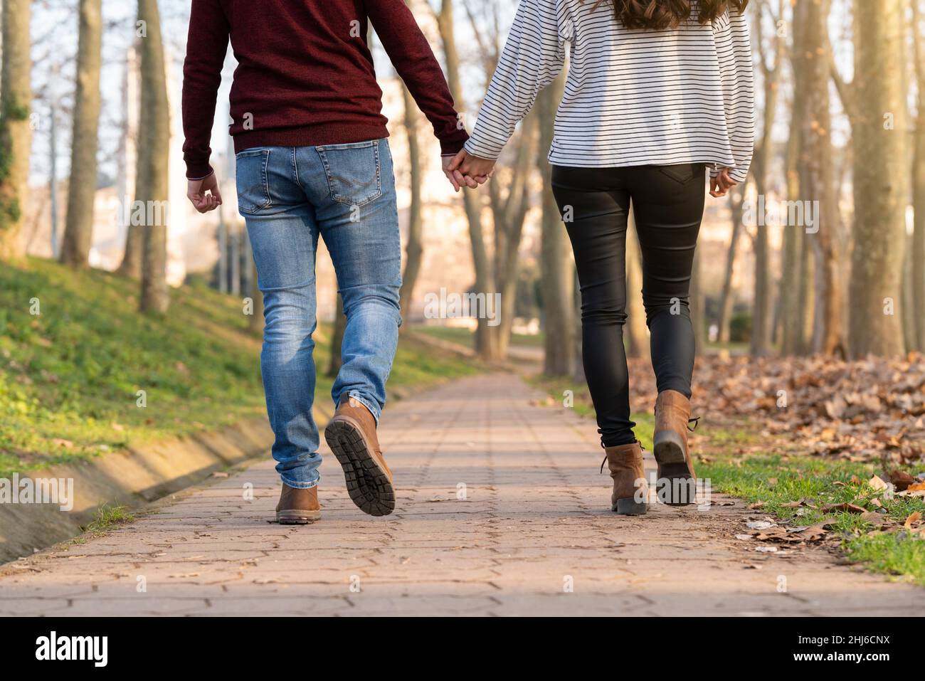 Young couple walking and hugging hi-res stock photography and images ...