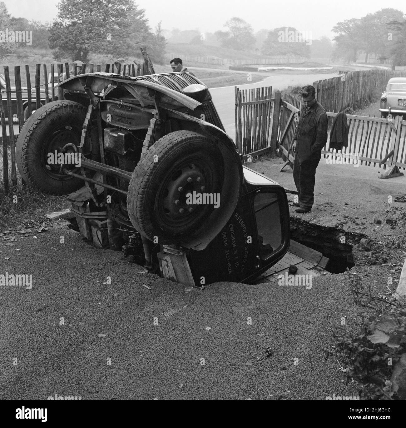 As Frank Mercer was driving his 3 ton lorry near the Crystal Palace part of the road caved in. The lorry, pictured, took a backward dive into the hole. Frank, was treated in hospital for shock. 8th October 1957. Stock Photo
