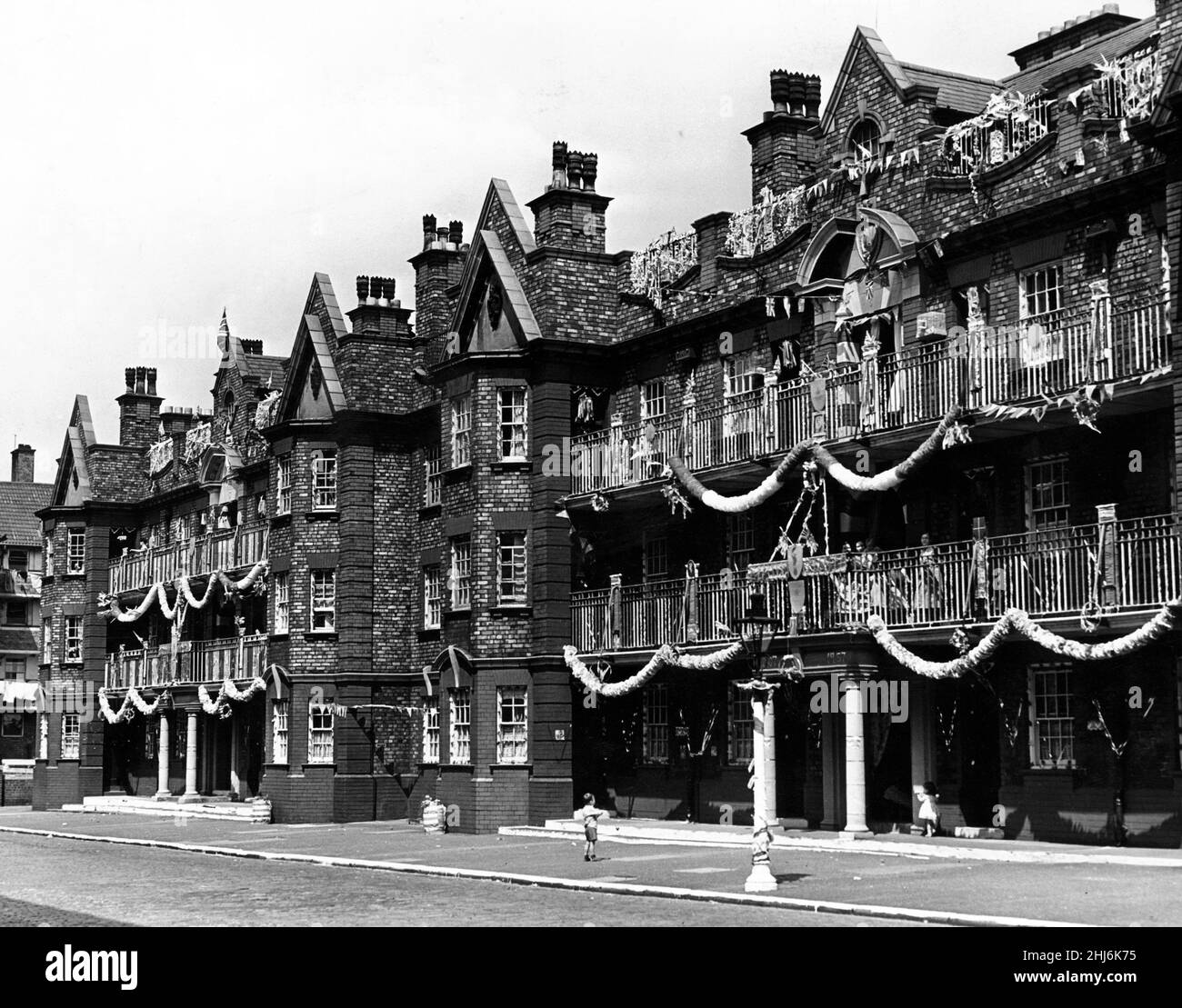 Even the lampost disappears beneath coloured bunting in this scheme in