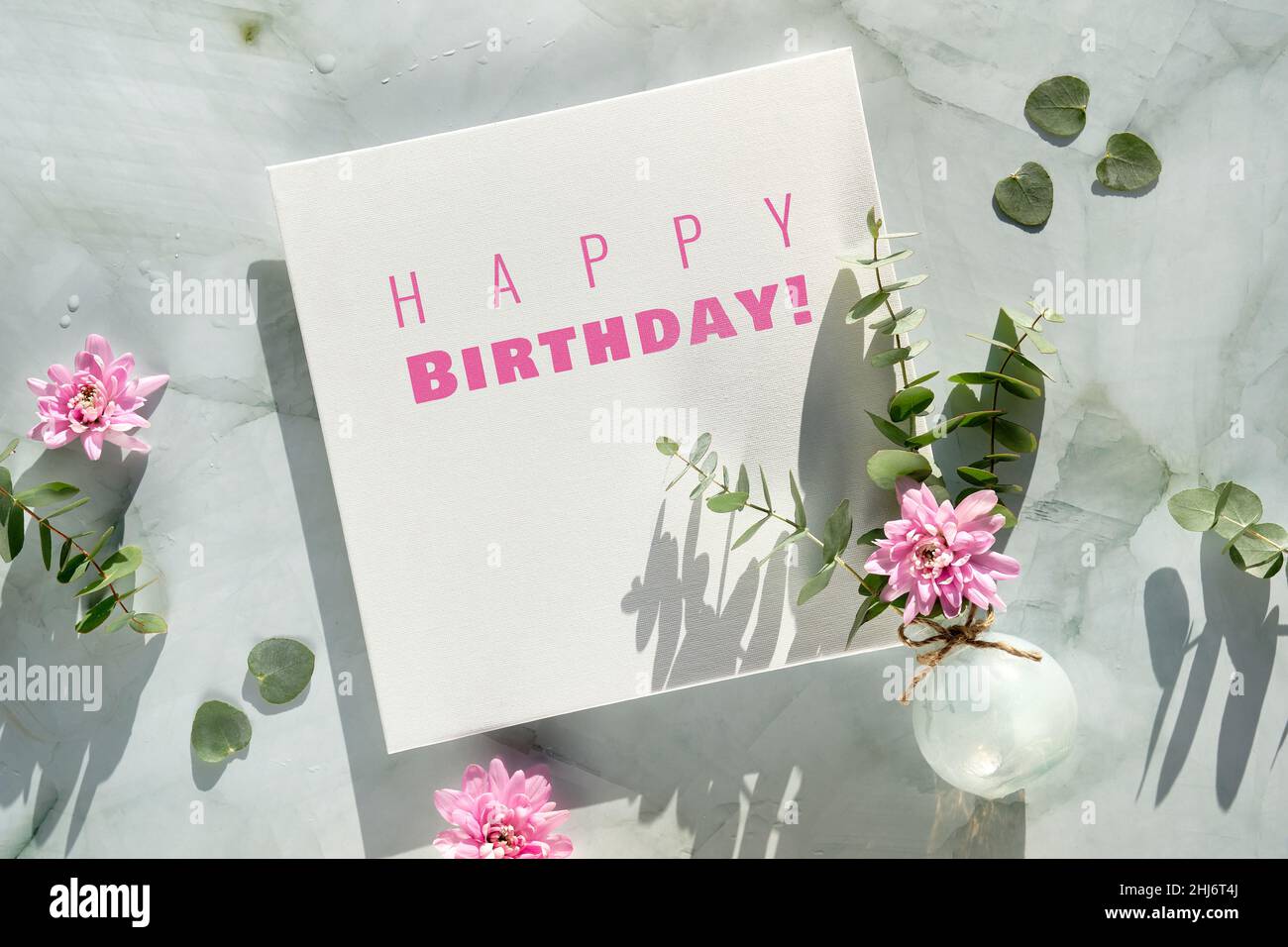 Happy birthday text on square canvas and winter, early spring