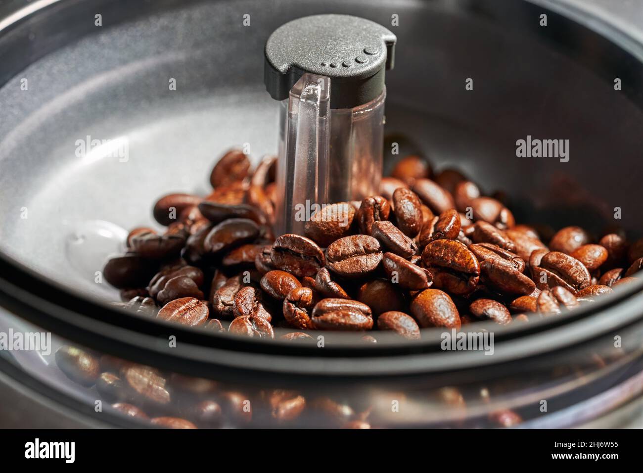 fresh coffee beans in coffee Machine grinders Stock Photo Alamy
