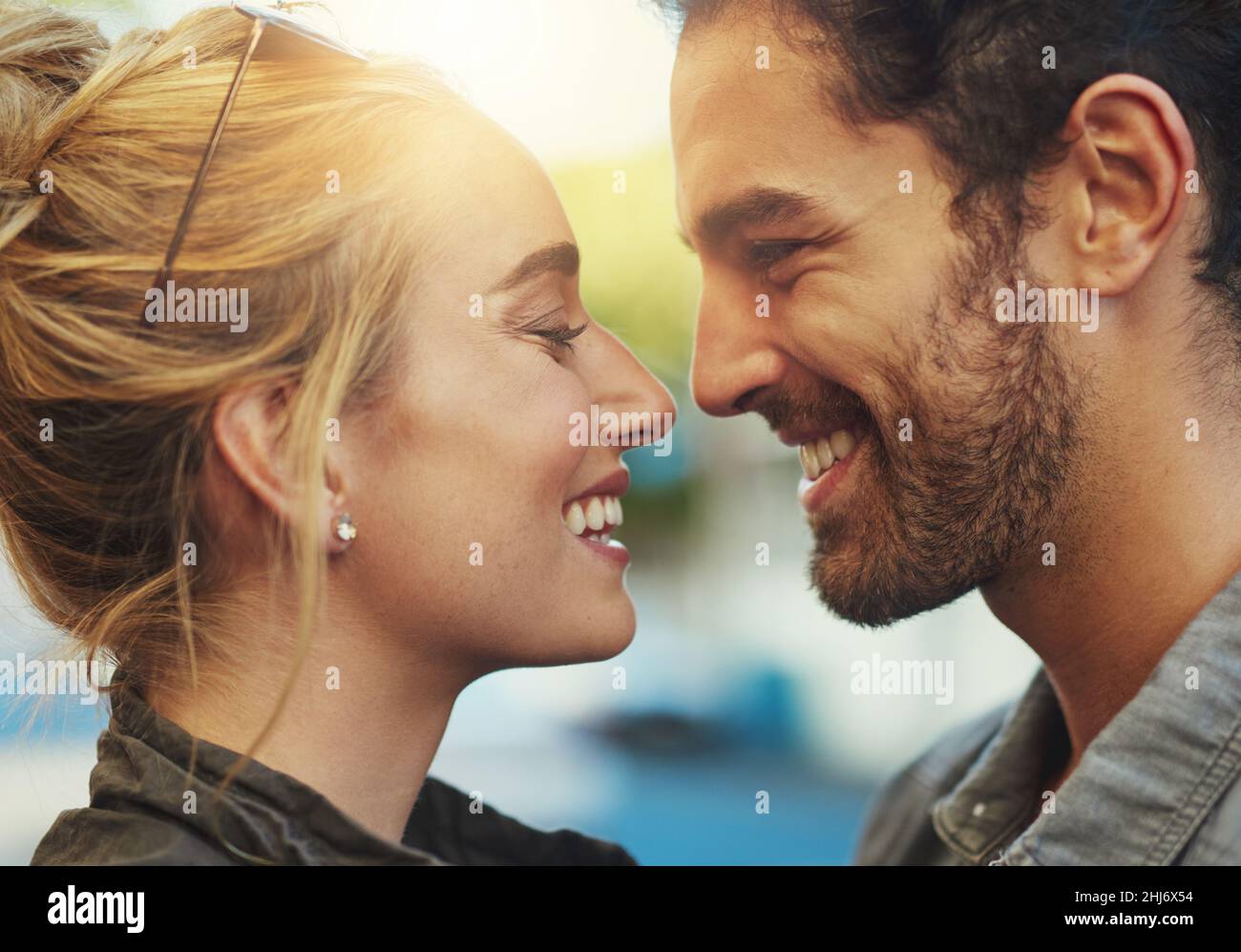 Growing closer by the day. Shot of a young couple out in the city Stock ...