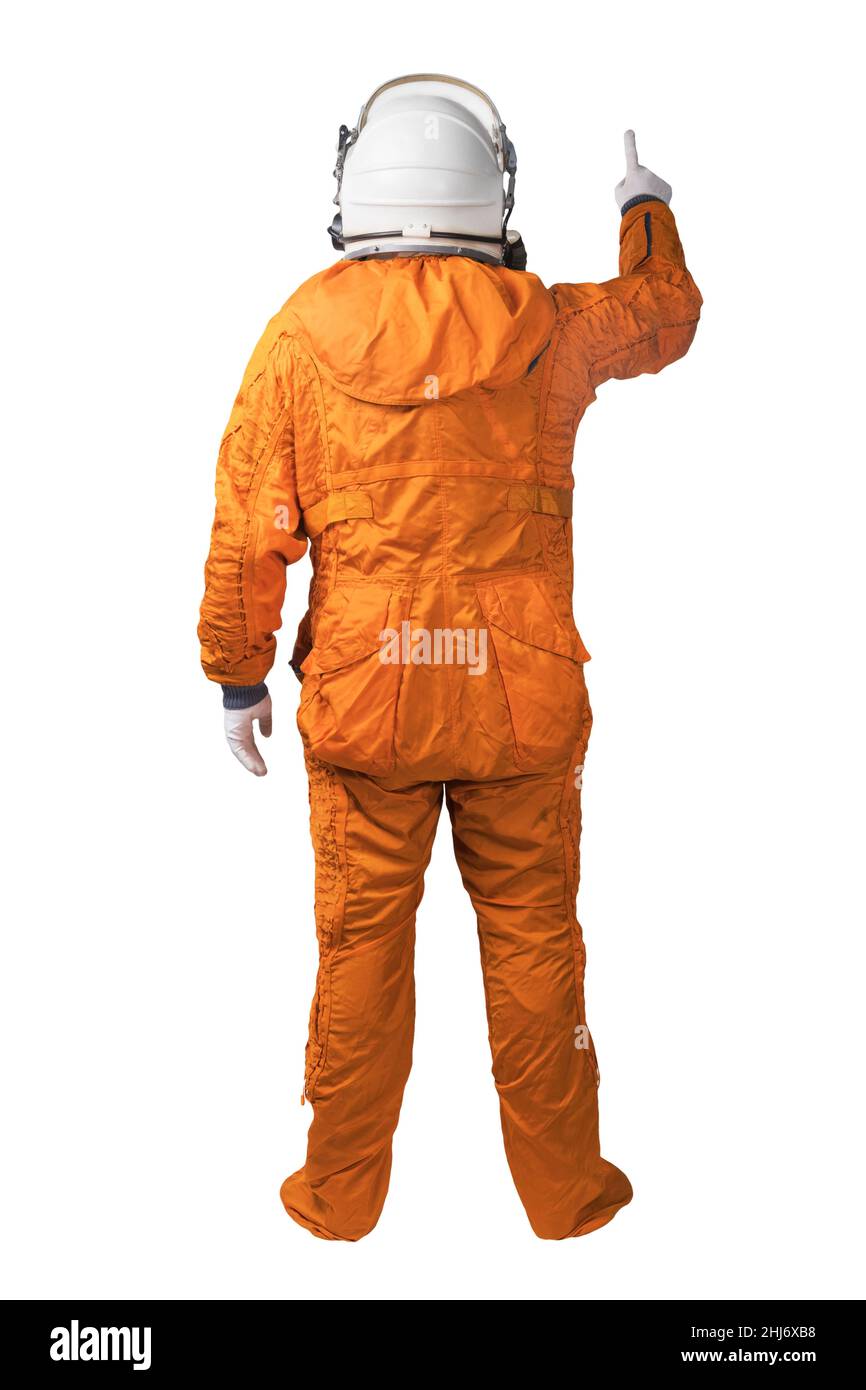 Astronaut wearing an orange spacesuit and space helmet touching something or hand gesture or isolated on white background Stock Photo