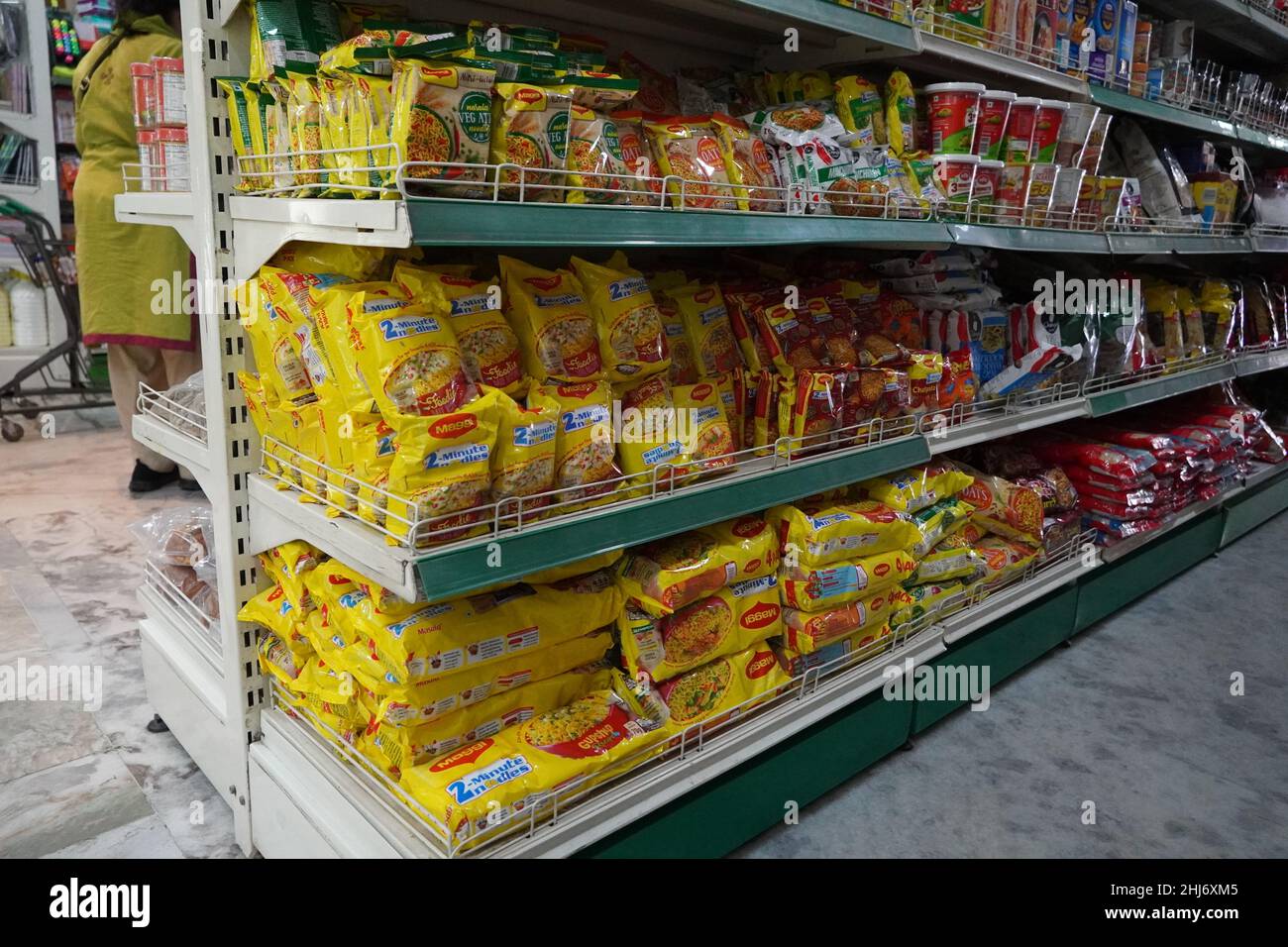 https://c8.alamy.com/comp/2HJ6XM5/several-packets-of-packaged-noodles-kept-on-shelf-for-sale-maggi-instant-noodles-on-display-at-supermarket-shelf-mumbai-india-march-2021-hdy-2HJ6XM5.jpg