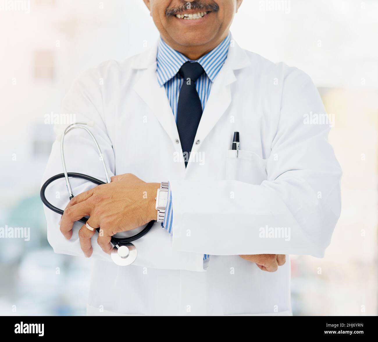 Confident healthcare professional stands arms hi-res stock photography ...