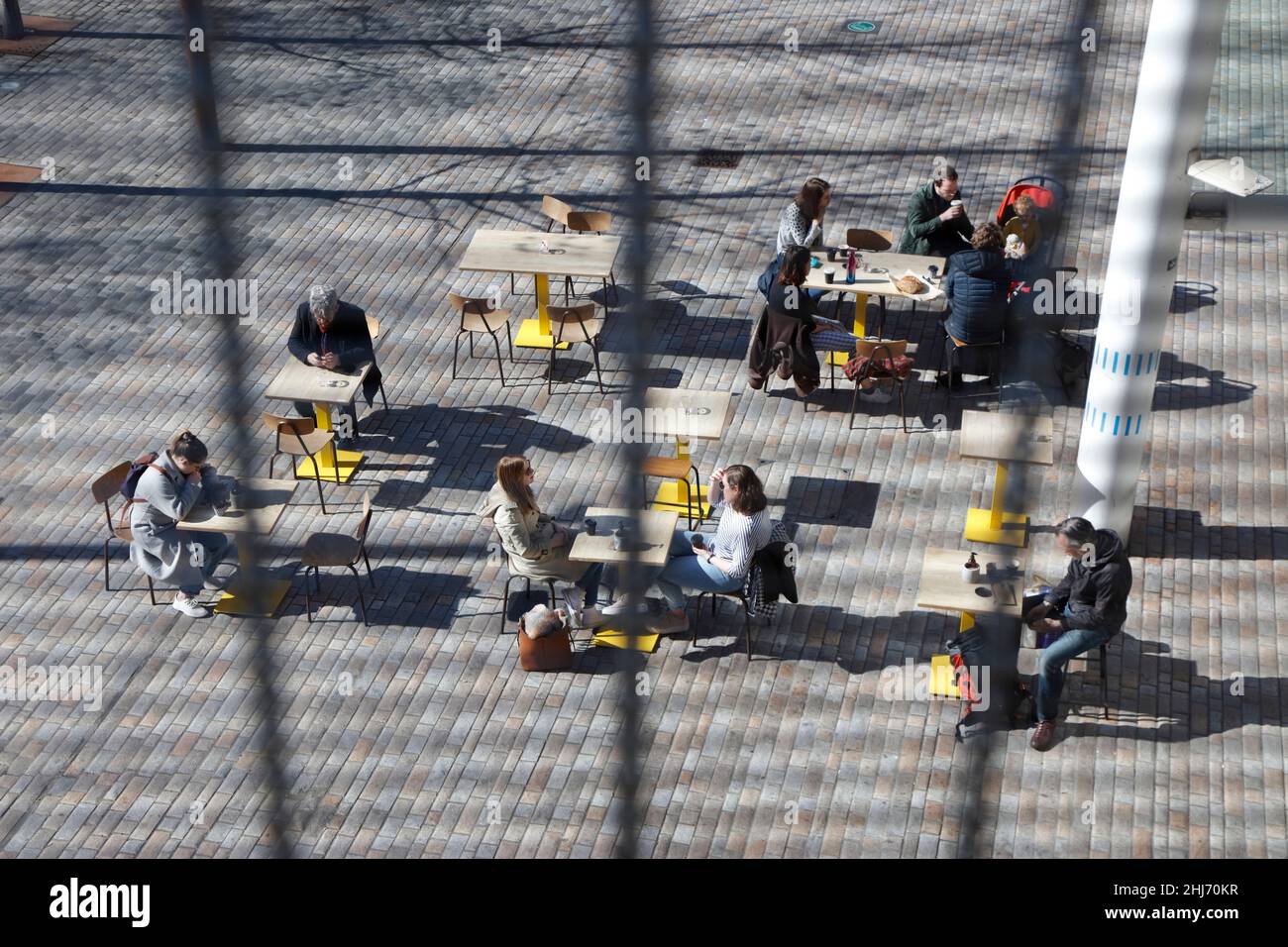 Looking down on outdoor cafe tables at Deptford Market Yard, Deptford, London, UK Stock Photo