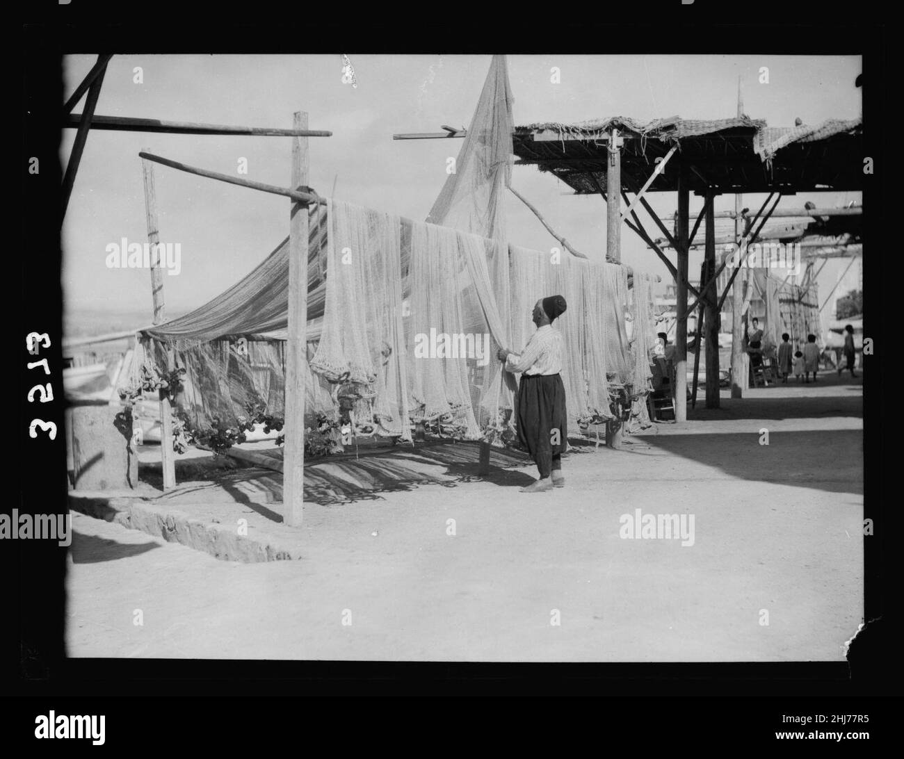Syria. Tyre to Tripoli and Krak de Chevalier. Sidon. Fisherman drying
