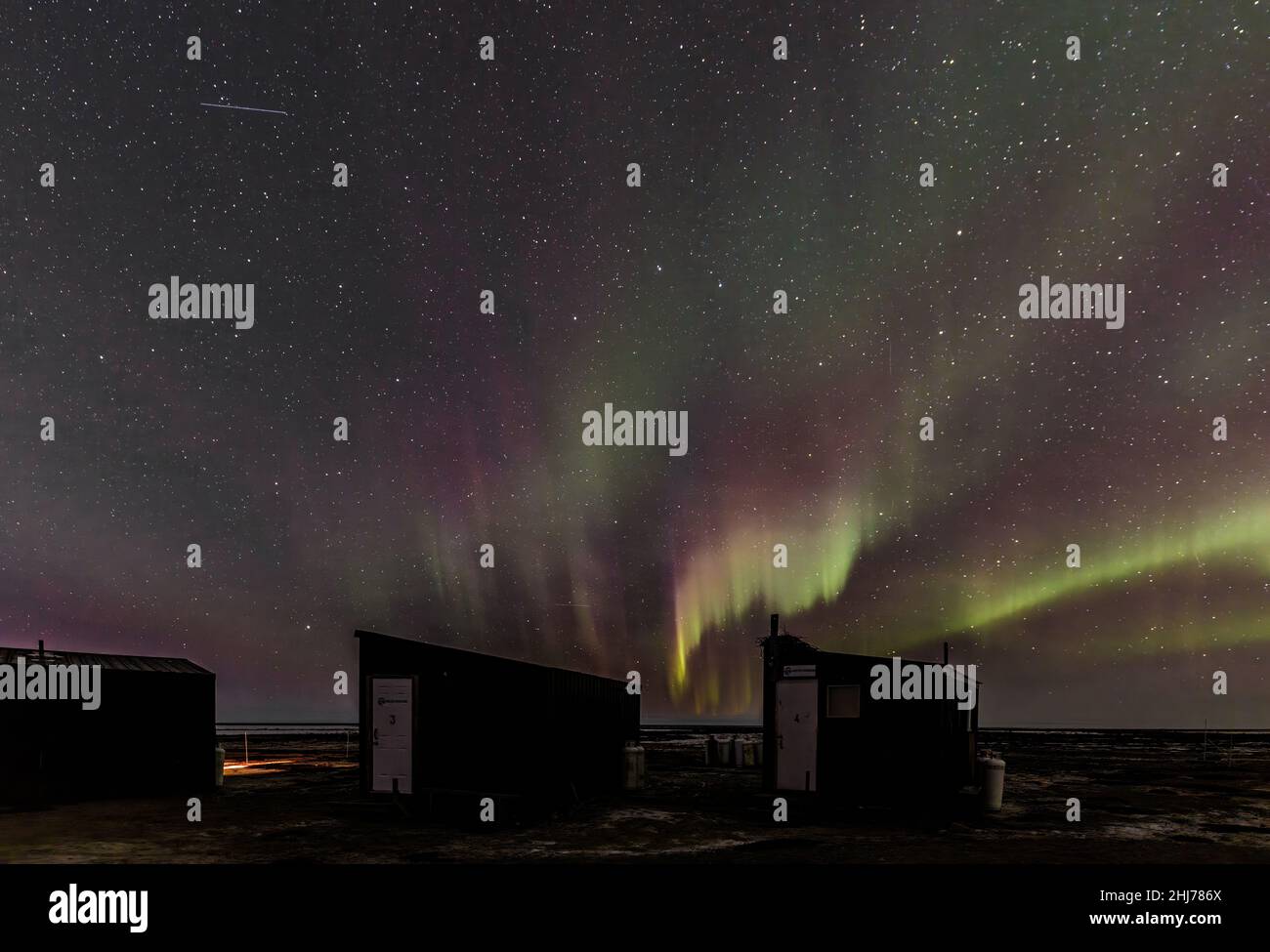 Northern lights (aurora borealis) seen over the site of a remote camp on the Hudson Bay, Canada Stock Photo