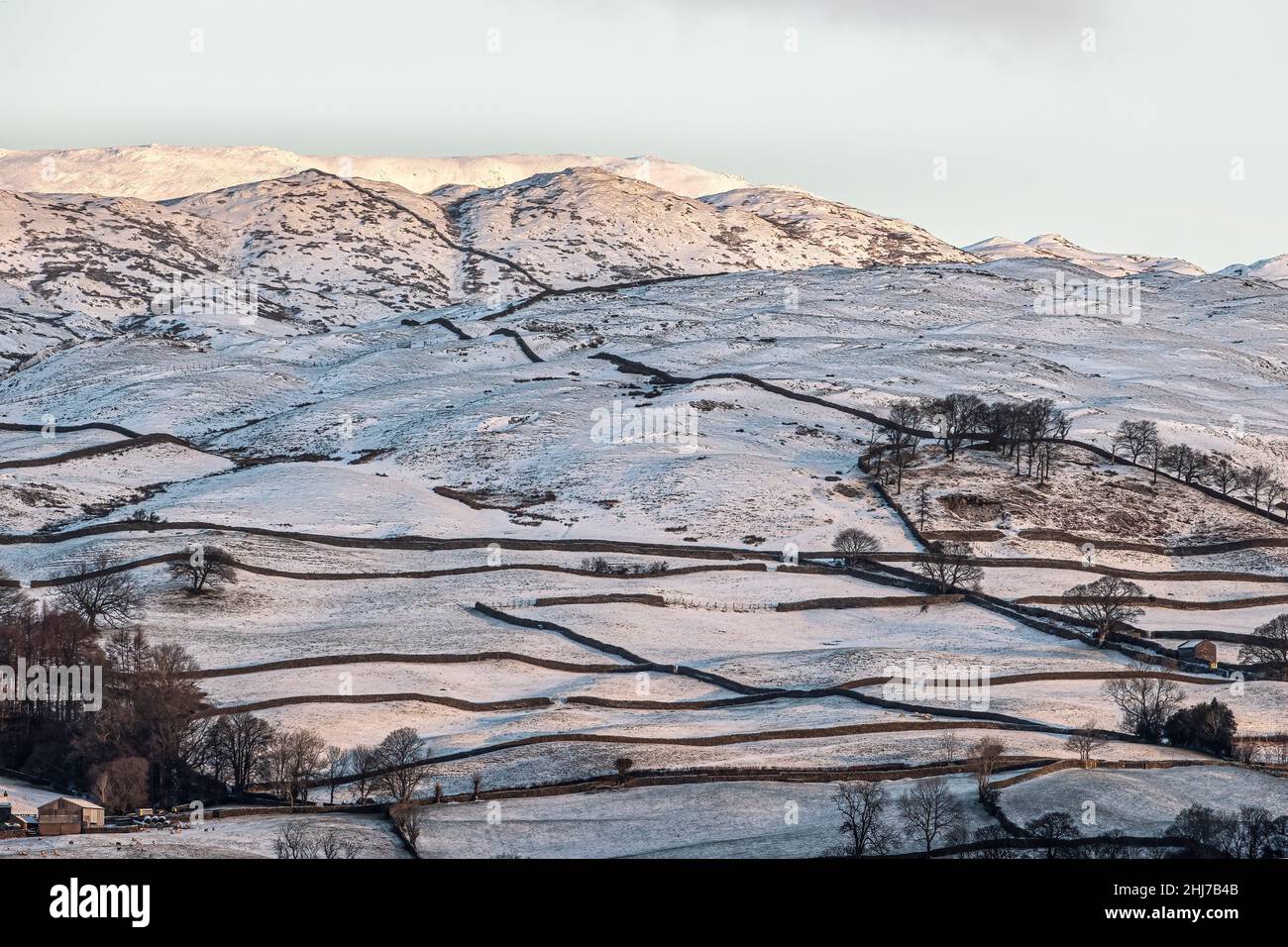 Snow on the fields and fells of Cumbria Stock Photo